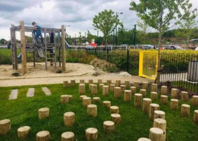 Playground with stepping logs and climbing apparatus